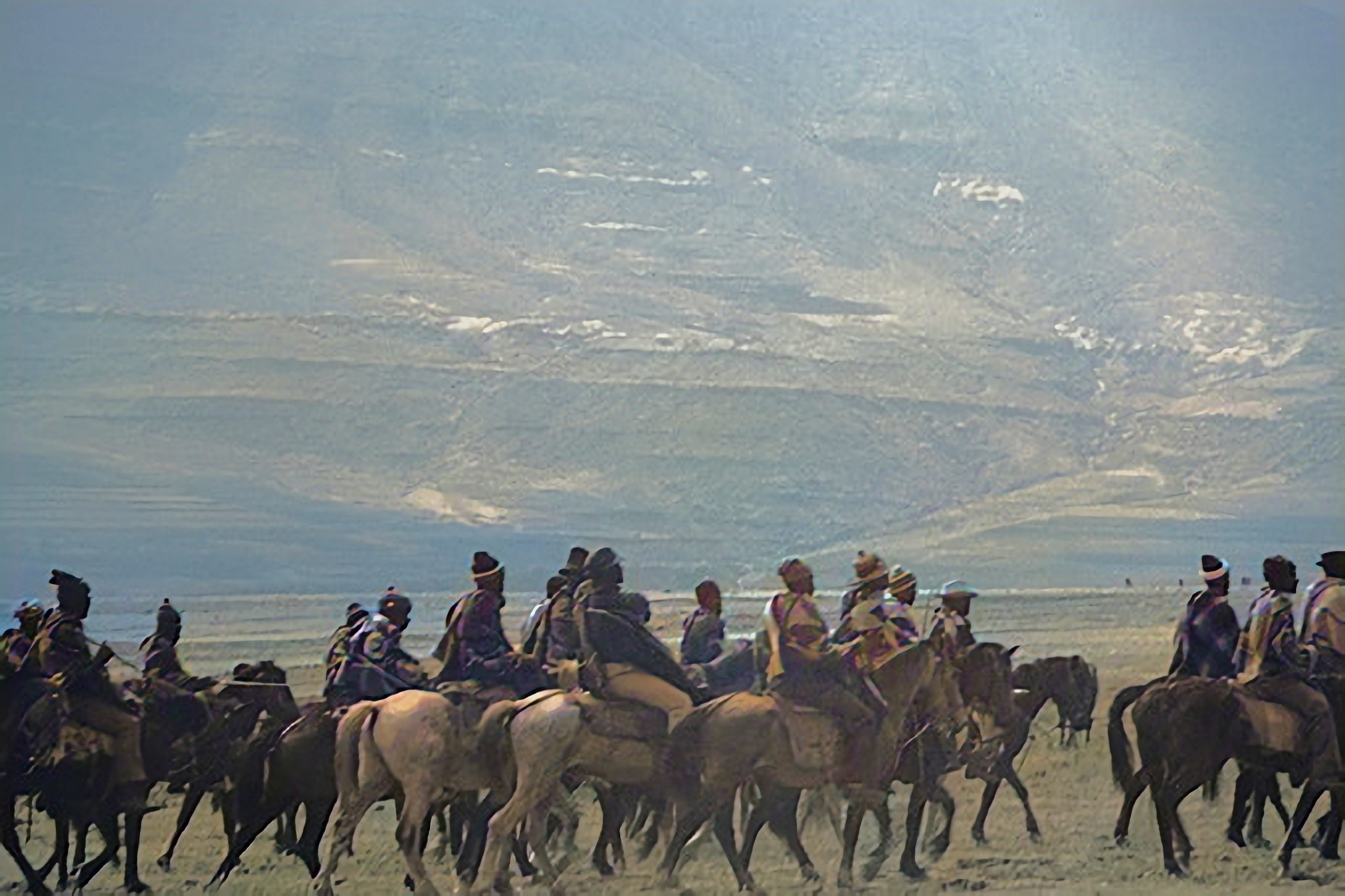 Basotho Horsemen moving across the valley on horseback for a meeting.